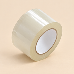 2' X 110 YARD X 1.8 MIL (ADHESIVE TAPE) - 36CT — illustrative studio photo on beige