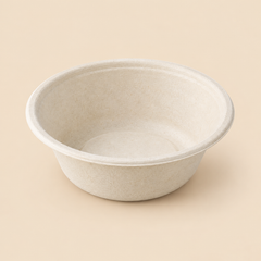 Illustrative product mockup: one empty unbranded 12-fluid-ounce disposable biodegradable molded-fiber round bowl, off-white natural bagasse texture, moderately deep bowl with flared sides and circular rim; no lid