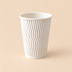 10oz WHITE TRIPPLE WALL RIPPLE COFFEE CUP 500CT — illustrative mockup on beige background