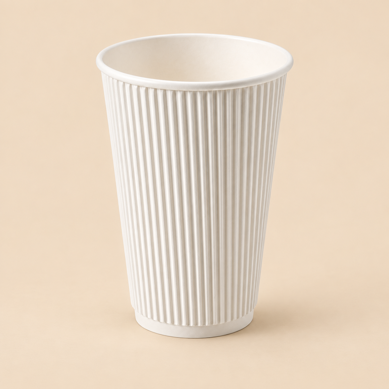 16oz WHITE TRIPPLE WALL  RIPPLE COFFEE CUPS 500CT on beige studio background